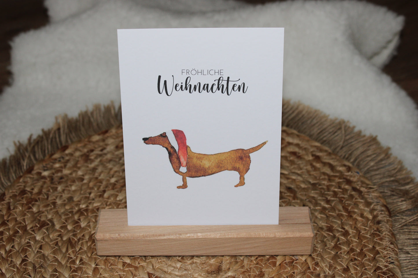 Weihnachtspostkarte - Dackel mit Weihnachtsmütze