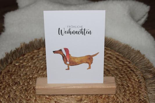 Weihnachtspostkarte - Dackel mit Weihnachtsmütze